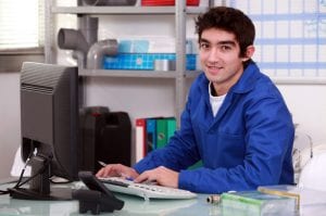 plumber at computer